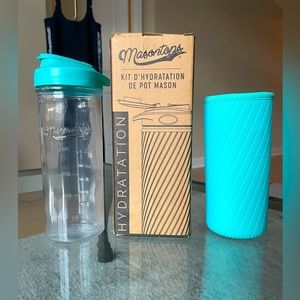 Mason-tops glass tumbler/water bottle; teal color with protection sleeve.